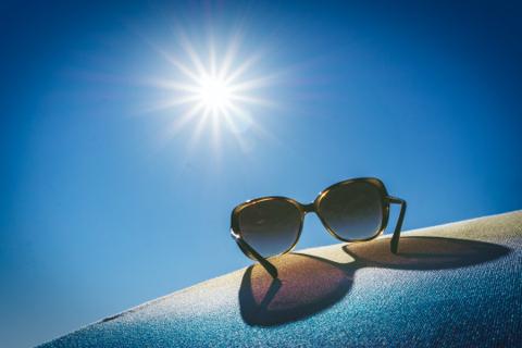 a sunglass below the scorching heat of summer 
