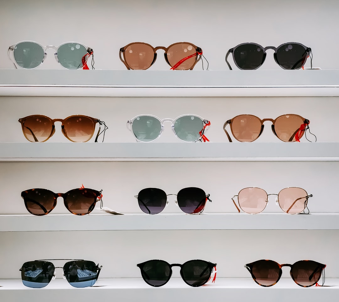 a collection of sunglasses on the shelfs